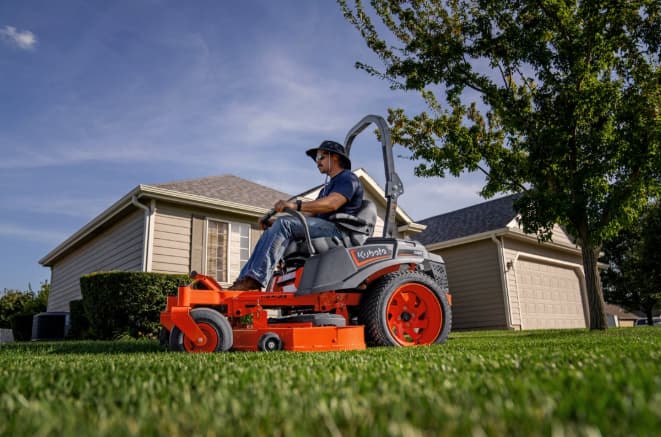 Kubota Z252 residential zero-turn mower mowing a lawn, for sale at Bobby Ford in Angleton