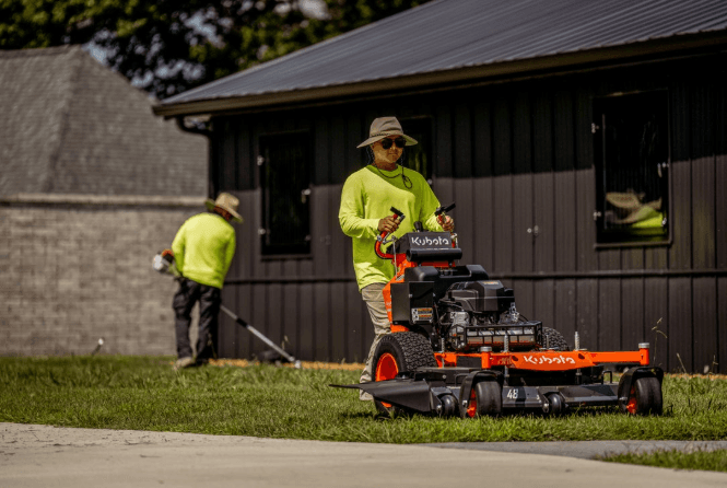 Kubota WHF15 48-inch walk-behind mower cutting grass, for sale at Bobby Ford in Angleton
