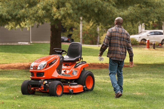 Kubota GR2120 diesel lawn and garden tractor on a backyard lawn, for sale at Bobby Ford in Angleton